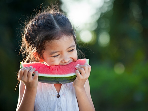 Little girl eating watermelon_crop